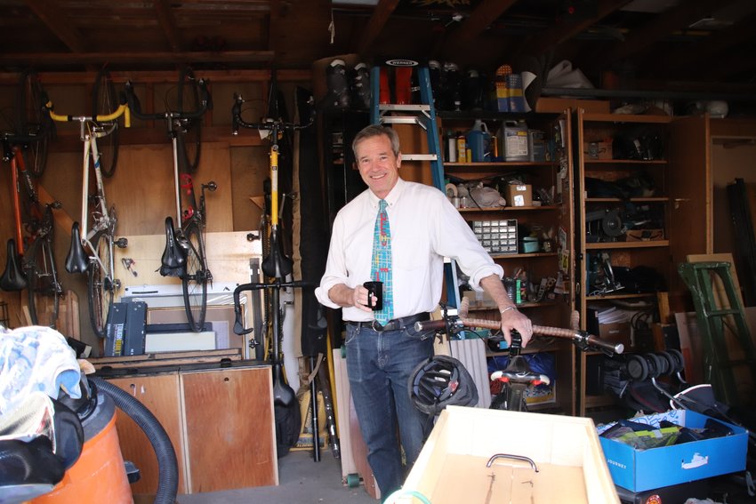 Ted Schultz poses in his garage in the Washington Park neighborhood.